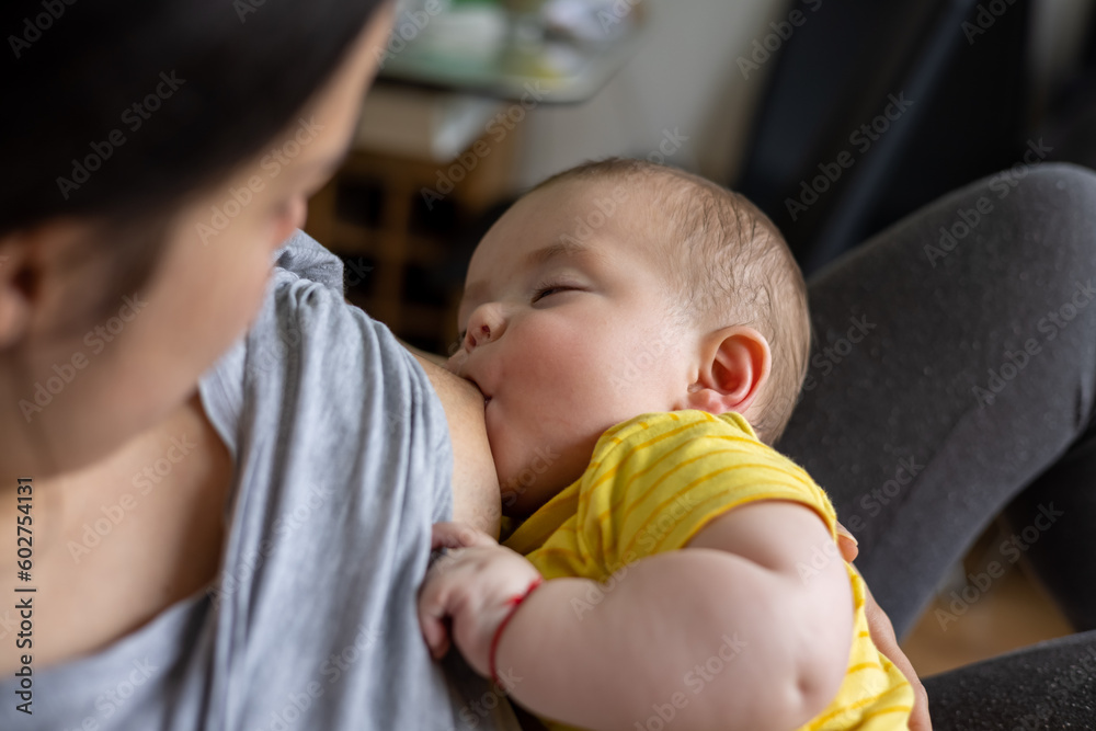 adorable baby boy infant toddler eating breast milk from mother.female woman breastfeeding newborn child.cute little small hands baby is falling asleep.hungry kid.love and care,maternity leave adorable baby boy infant toddler eating breast milk from mother.female woman breastfeeding newborn child.cute little small hands baby is falling asleep.hungry kid.love and care,maternity leave