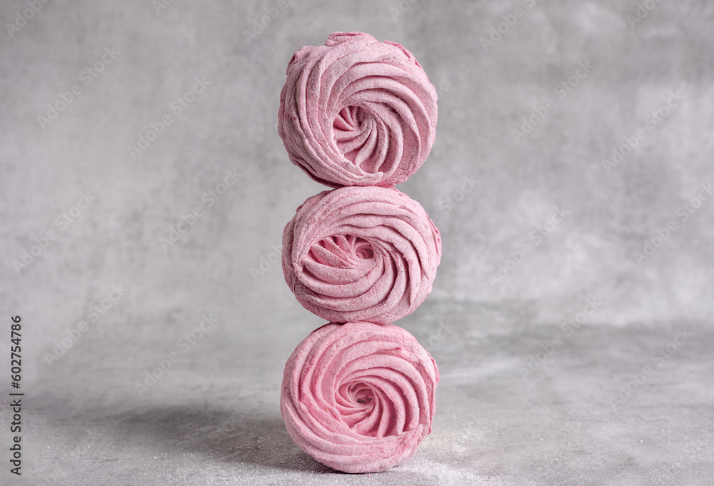 tasty delicious homemade zephyr pink marshmallows with blackberries taste.sweet dessert in box,on kitchen towel,gray tiles surface.whisk tea strainer accessories,sugar powder.pattern close up texture tasty delicious homemade zephyr pink marshmallows with blackberries taste.sweet dessert in box,on kitchen towel,gray tiles surface.whisk tea strainer accessories,sugar powder.pattern close up texture