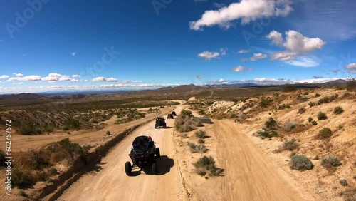 UTV driving on a dirt trail in the desert