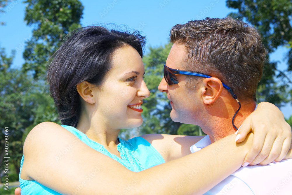 a portrait of attractive couple in summer environment a portrait of attractive couple in summer environment