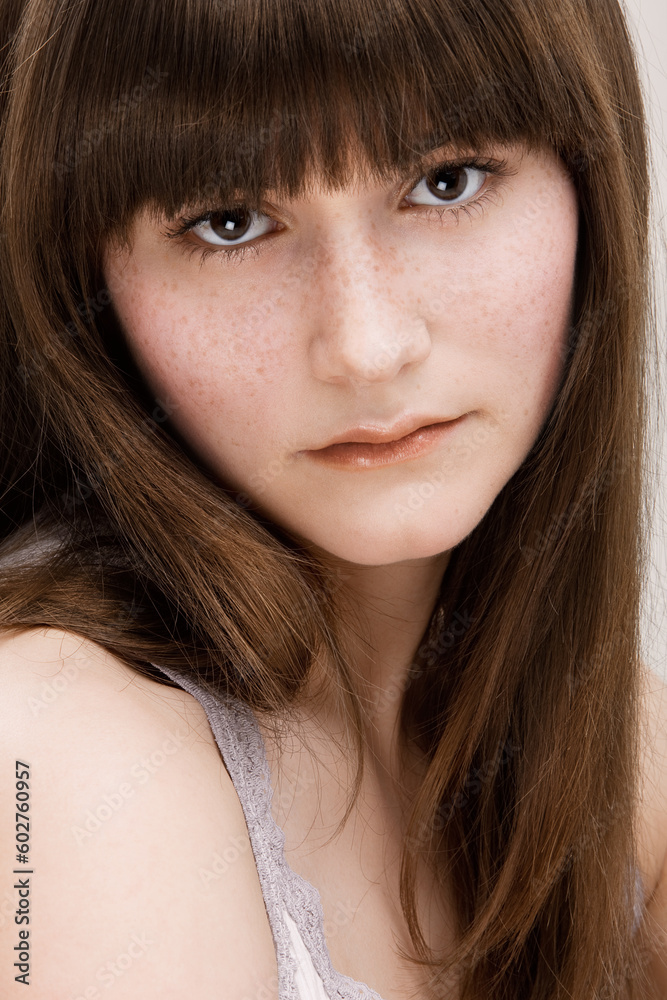 Desaturated portrait of young beautiful girl with freckles Desaturated portrait of young beautiful girl with freckles