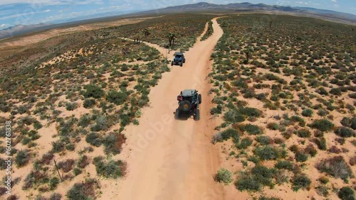 UTV driving on a dirt trail in the desert photo