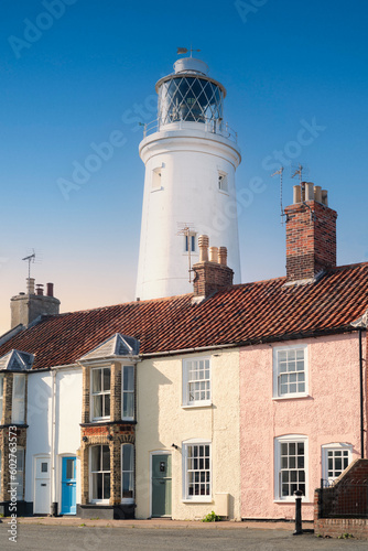 The lighthouse behind and towering above houses in the seaside town of Southwold in Suffolk, uk. photo