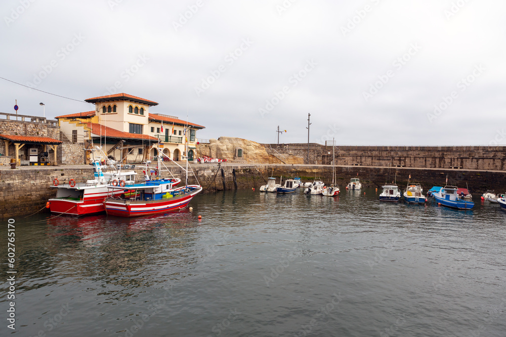 nice fishing port in the spanish town of comillas, cantabria.