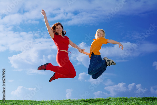 Flying  Family. Mother and Son Jumping