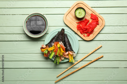 Plate with tasty sushi cone...