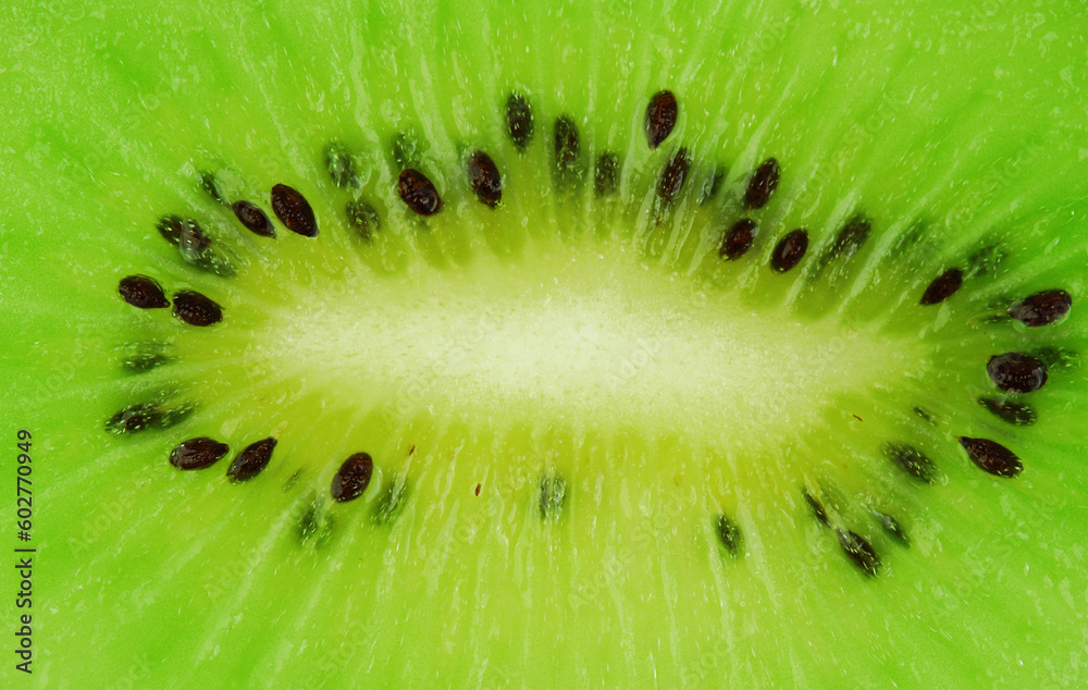Kiwi fruit macro shot - fresh green background Kiwi fruit macro shot - fresh green background