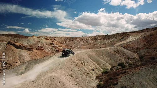 UTV Driving up a desert trail photo