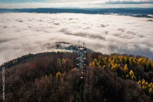 Aerial Drone Shot: Sightseeing Tower in Brezno, Autumn Scenery with Misty Morning and Cloud Inversion in Horehronie Region photo