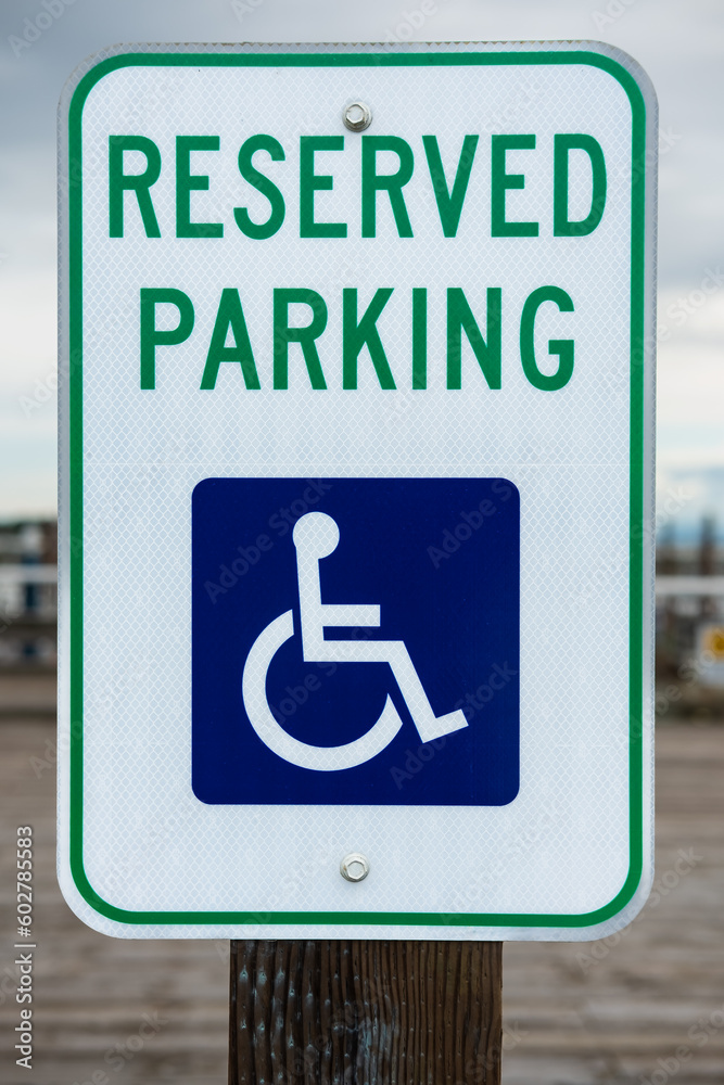 Handicapped parking spot. Blue handicapped sign parking spot. Disabled parking permit sign on pole. Handicapped parking spot. Blue handicapped sign parking spot. Disabled parking permit sign on pole.