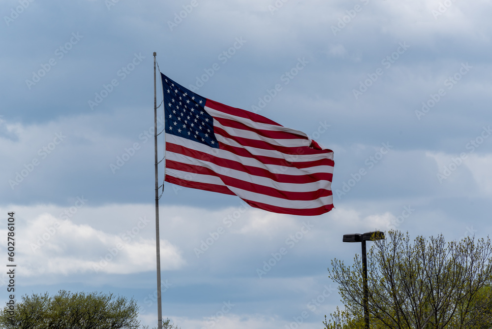 American Flag Flying In A Cloudy Sky American Flag Flying In A Cloudy Sky