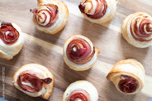 Puff pastry swirls. Close-up of puff pastry with prosciutto.