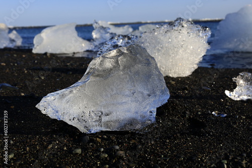 View of an iceberg on the beach of Breiðamerkursandur which is a glacial outwash plain in southeast Iceland. photo