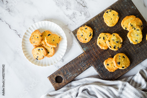 Italian style round shortbread cookies with black olives and Parmesan cheese