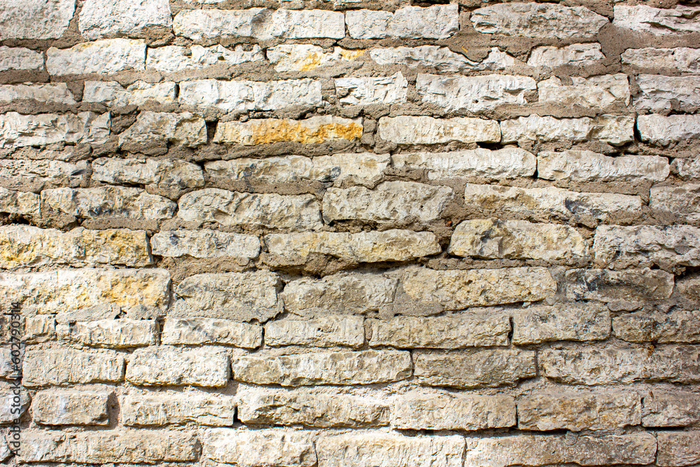 Wall made of natural light stone, texture, background. Wall made of natural light stone, texture, background.