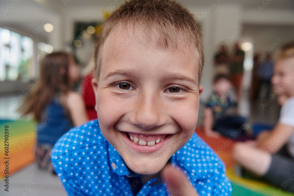 Portrait photo of a smiling boy in a preschool institution having fun Portrait photo of a smiling boy in a preschool institution having fun