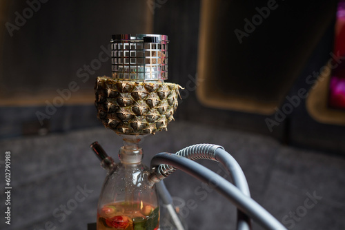 Stylish hookah with the aroma pineapple for relax.Pineapple shisha.Hookah lounge. photo