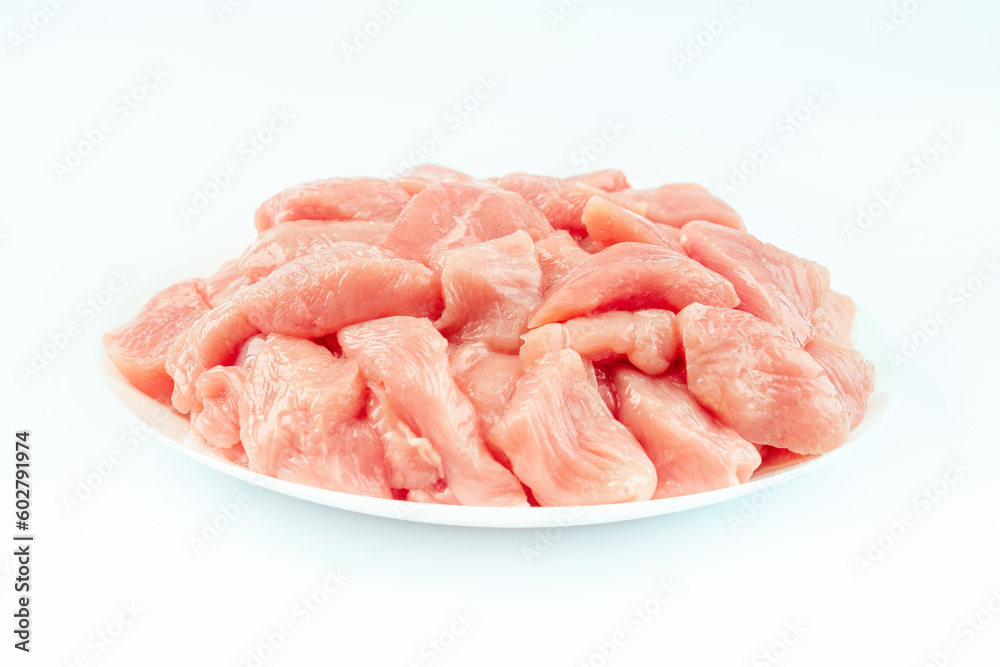 Fresh frozen pieces of turkey meat on a white background.Raw chicken.Frozen chicken fillet..Ogranic food and healthy eating.frozen turkey or poultry meat.