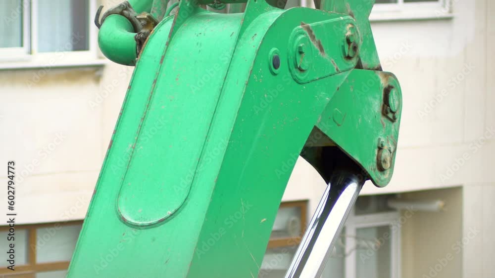 Close up detail's on truck in process of transport over elevator with pump for concrete. Steel hydraulic piston to crane, which lifts and lowers the concrete pump arm during construction work
Close up detail's on truck in process of transport over elevator with pump for concrete. Steel hydraulic piston to crane, which lifts and lowers the concrete pump arm during construction work