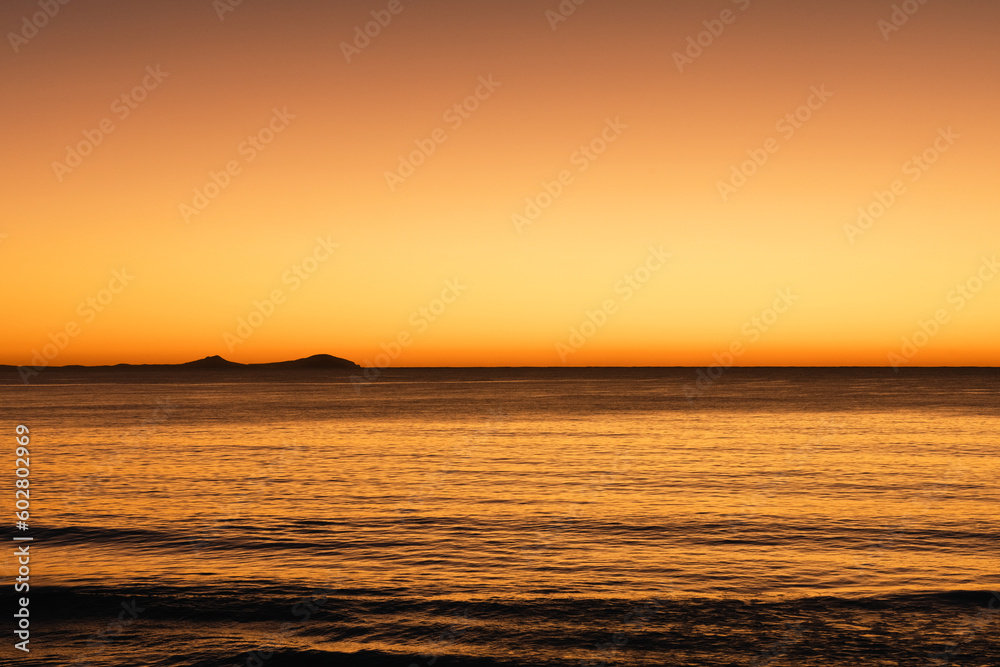 Vibrant sunrise over the water at Jimmy's Beach, Hawks Nest NSW Australia