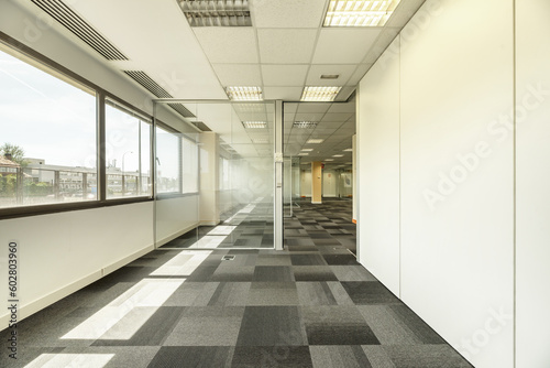 Some offices with glass partitions, large windows, technical ceilings