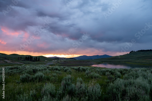 Sun Fades Behind Thick Clouds At Sunet In Hayden Valley