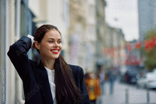 Fashion woman smile spring walking in the city in stylish clothes with red, travel, cinematic color, retro vintage style, urban fashion lifestyle.