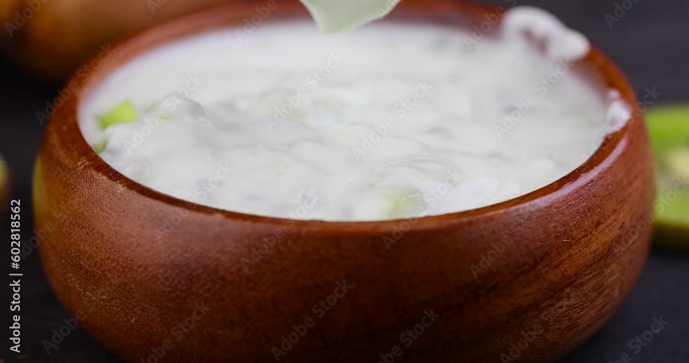 fresh yogurt made from natural ingredients with kiwi, milk fresh yogurt with kiwi flavor and kiwi slices fresh yogurt made from natural ingredients with kiwi, milk fresh yogurt with kiwi flavor and kiwi slices