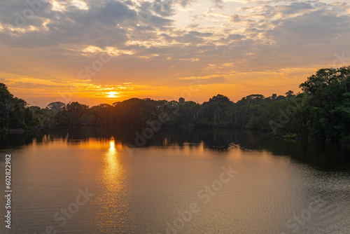 Amazon rainforest sunrise by Garzacocha Lagoon, Yasuni national park, Ecuador.