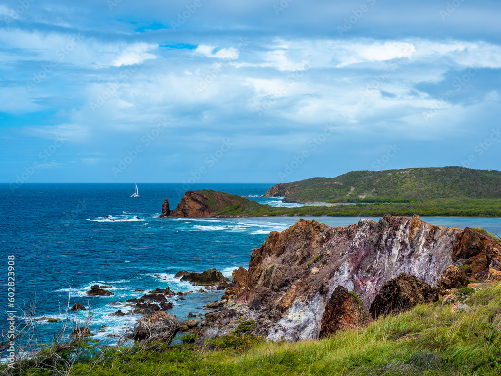 Cas Cay Looking Towards St Thomas in the US Virgin Islands with Waves Crashing in Tropical Waters
