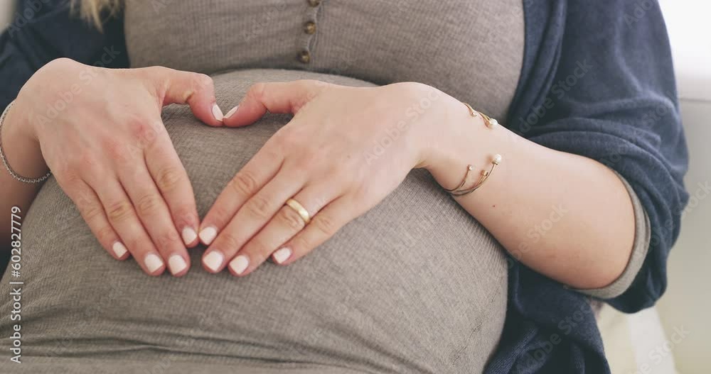 Love, heart hands and stomach of pregnant woman on sofa for health, excited and motherhood. Peace, calm and maternity with gesture on belly of mother in living room for wellness, relax and pregnancy Love, heart hands and stomach of pregnant woman on sofa for health, excited and motherhood. Peace, calm and maternity with gesture on belly of mother in living room for wellness, relax and pregnancy