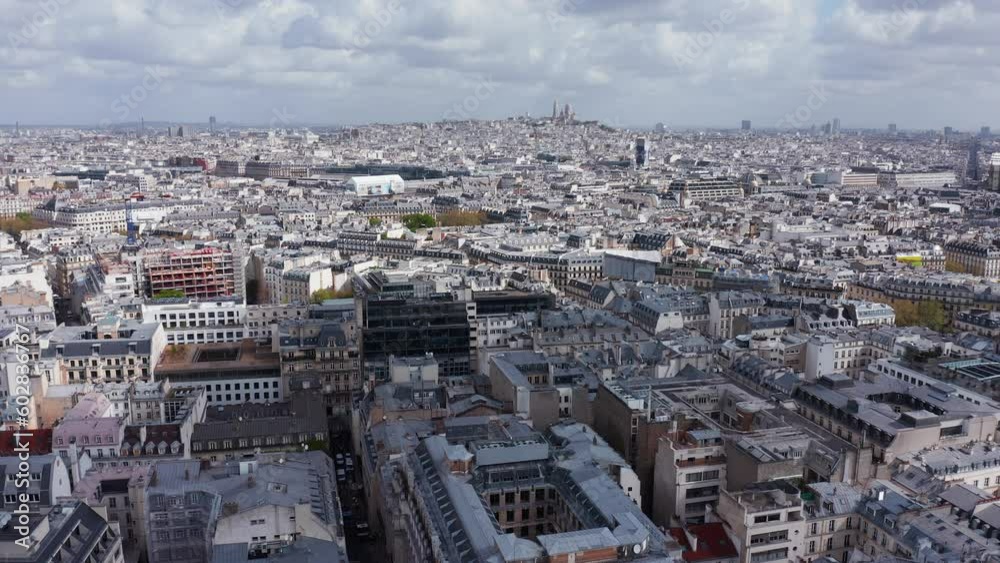 Aerial above Paris rooftops on sunny day, urban grid, France Aerial above Paris rooftops on sunny day, urban grid, France