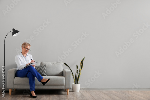 Mature psychologist working...