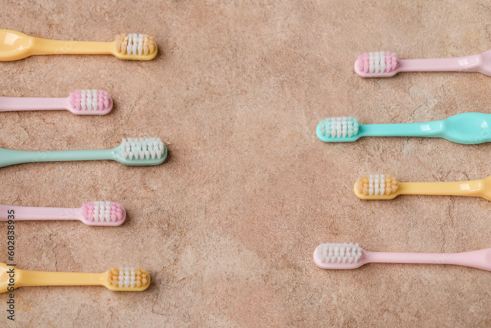 Different plastic toothbrushes on color background Different plastic toothbrushes on color background