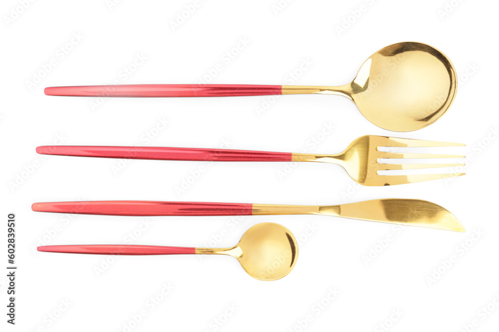 Golden set of cutlery with red handles on white background Golden set of cutlery with red handles on white background