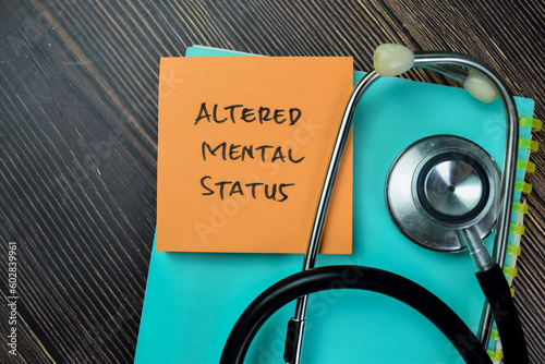 Fotografia Concept of Altered Mental Status write on sticky notes with stethoscope isolated on Wooden Table