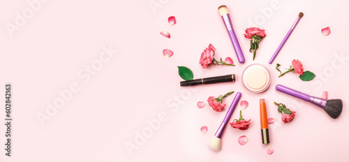 Makeup and cosmetic beauty products arranged on a pink background. Flat lay. Beauty concept