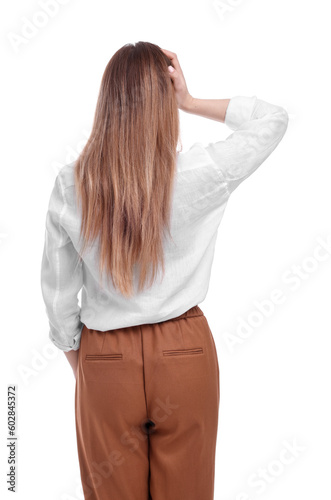 Businesswoman standing on white background, back view