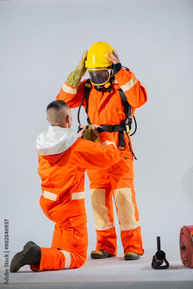 The image serves as a reminder of the essential role played by teamwork and support in the challenging and potentially dangerous environment faced by firefighters. The image serves as a reminder of the essential role played by teamwork and support in the challenging and potentially dangerous environment faced by firefighters.