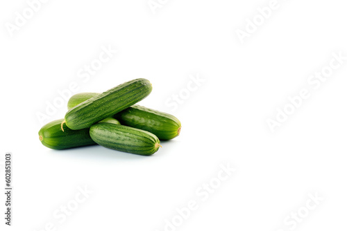 A pile of fresh green cucumbers isolated on white background with copy space. Created with Generative AI Technology