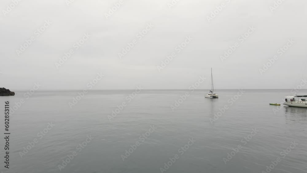 Boats and yachts stranded on calm waters in a cloudy environment. Aerial drone shot. Boats and yachts stranded on calm waters in a cloudy environment. Aerial drone shot.