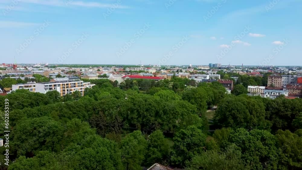 Riga Cityscape Spring Aerial Top View Video, Town, Latvia. Sunny Day Building Rooftops. Riga Skyline, Latvia, City Center, Ziedondarzs Park. City Center, Teika, Purvciems in the Background. Riga Cityscape Spring Aerial Top View Video, Town, Latvia. Sunny Day Building Rooftops. Riga Skyline, Latvia, City Center, Ziedondarzs Park. City Center, Teika, Purvciems in the Background.