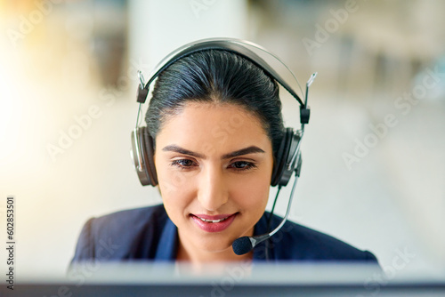 Call centre, agent and woman in headset with mic or employee on computer for consulting or customer support in the office. Operator, telemarketing and talking with customer online with advice