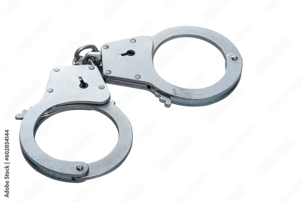 Metal handcuffs on a white isolated background, copy space Metal handcuffs on a white isolated background, copy space