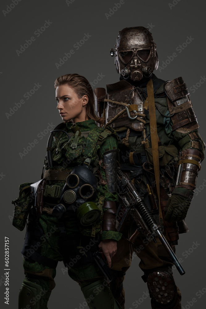 Couple of military female and male soldiers dressed in protective uniform. Couple of military female and male soldiers dressed in protective uniform.