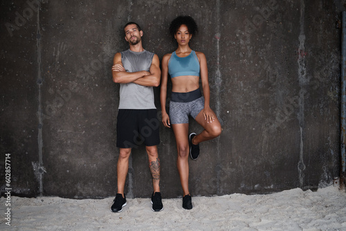 Exercise, serious and portrait of couple on wall background for workout, body builder training and fitness. Sports, space and man and woman sweat after running for endurance, wellness and health