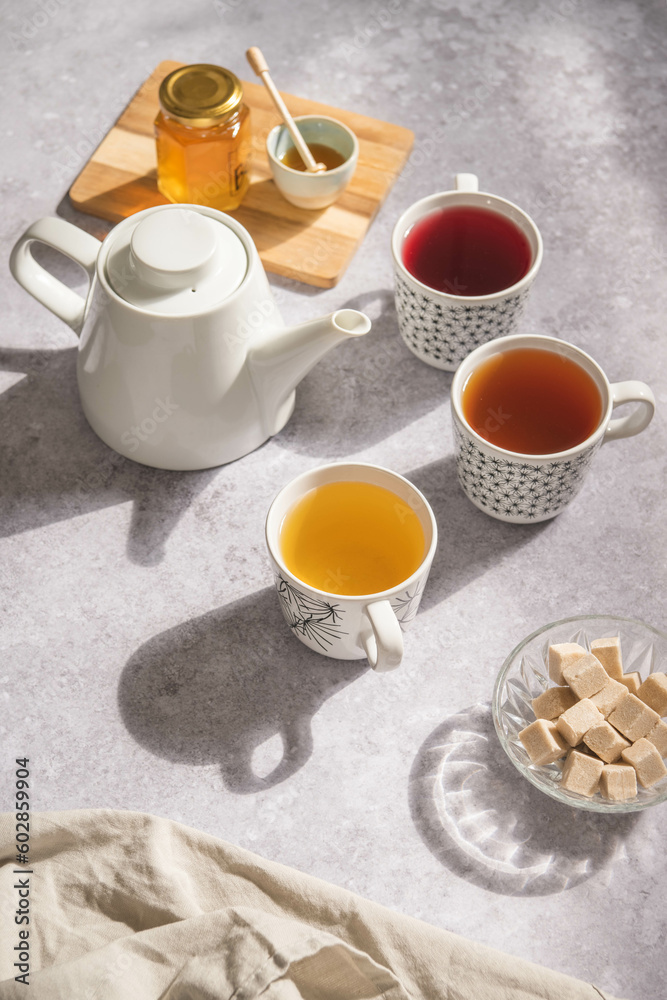A tea set with sugar and honey A tea set with sugar and honey