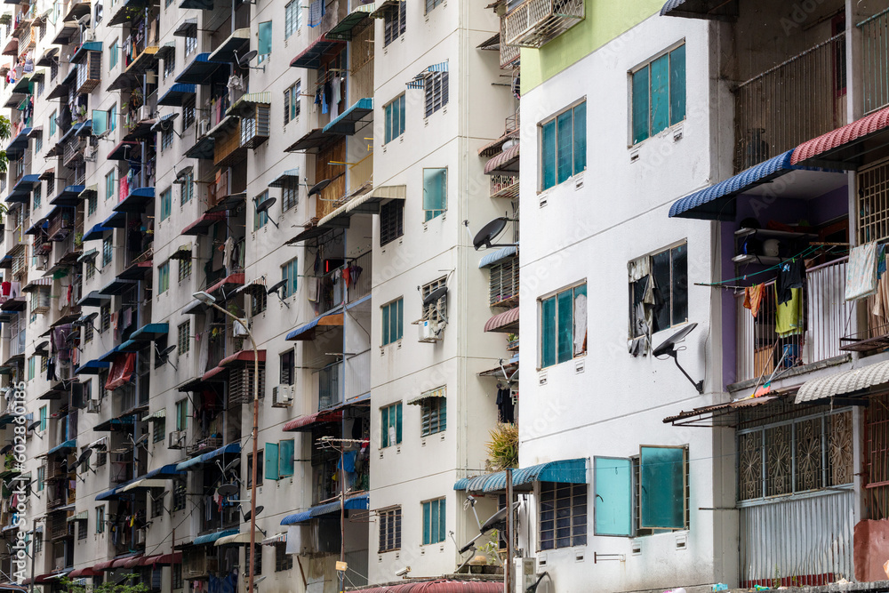 Exterior of compact residential building. Exterior architecture. Low cost residential building outlook. Low cost living condition. Urban poverty. Exterior of compact residential building. Exterior architecture. Low cost residential building outlook. Low cost living condition. Urban poverty.