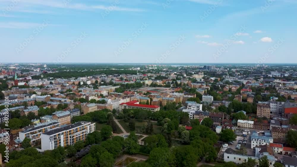 Riga Cityscape Spring Aerial Top View Video, Town, Latvia. Sunny Day Building Rooftops. Riga Skyline, Latvia, City Center, Ziedondarzs Park. City Center, Teika, Purvciems in the Background. Riga Cityscape Spring Aerial Top View Video, Town, Latvia. Sunny Day Building Rooftops. Riga Skyline, Latvia, City Center, Ziedondarzs Park. City Center, Teika, Purvciems in the Background.