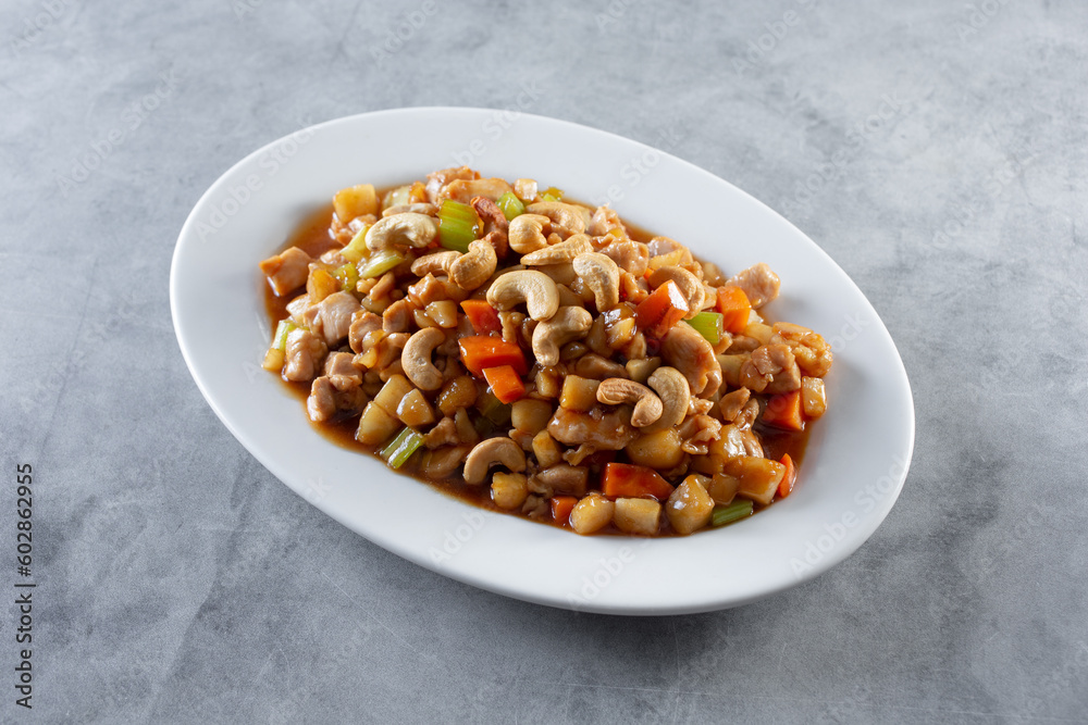 A view of a plate of cashew chicken. A view of a plate of cashew chicken.